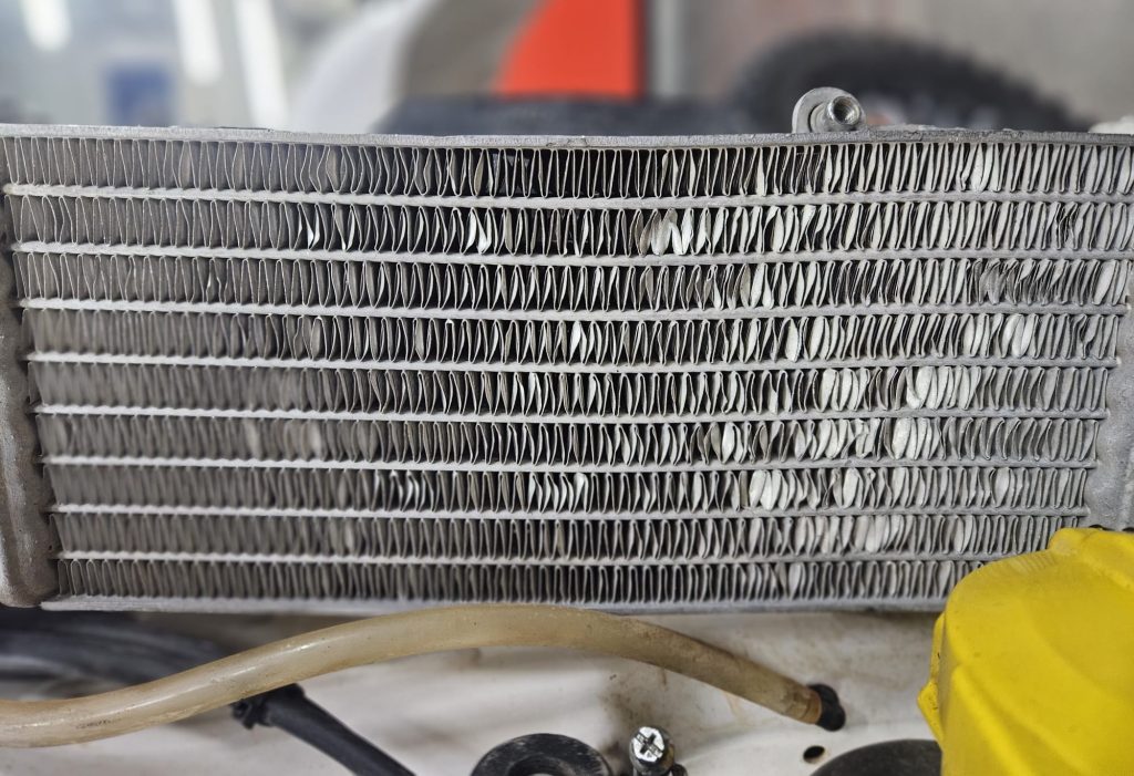 reparar radiador moto